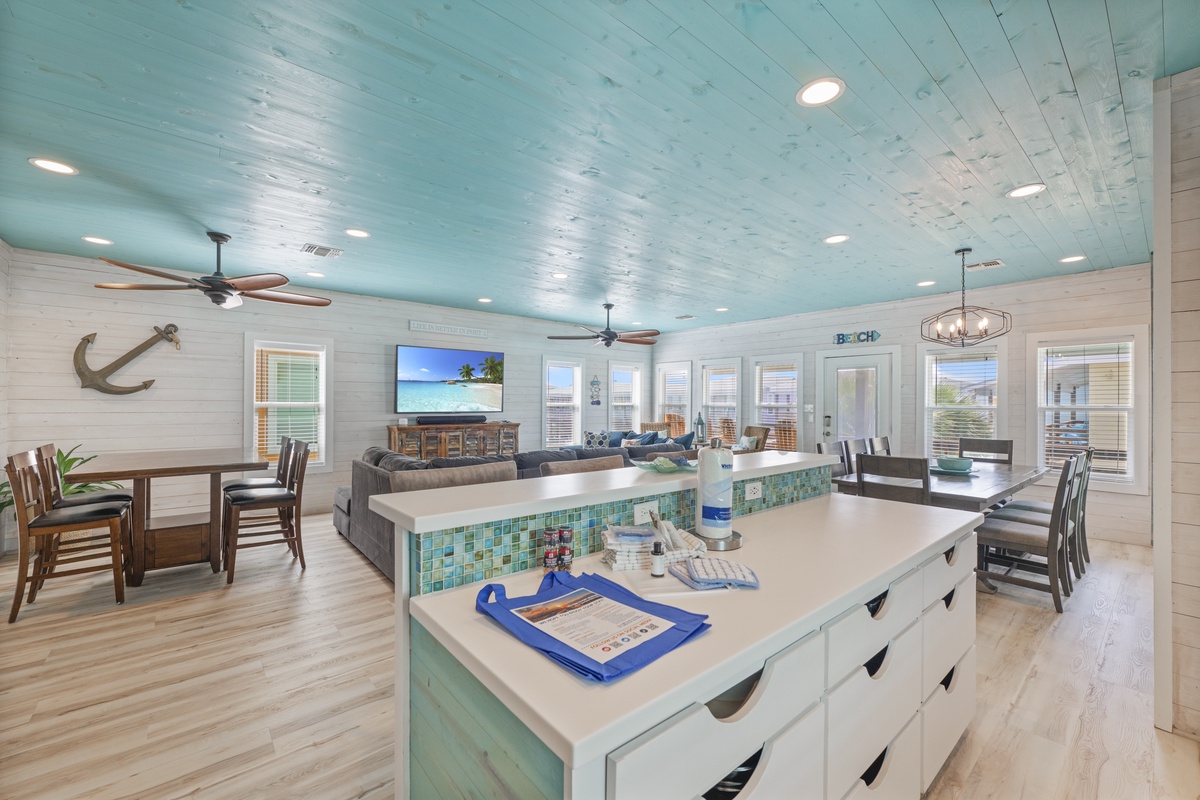 Bright coastal living awaits with spacious open-concept design, inviting island seating, and relaxed dining—your perfect beach getaway spot.