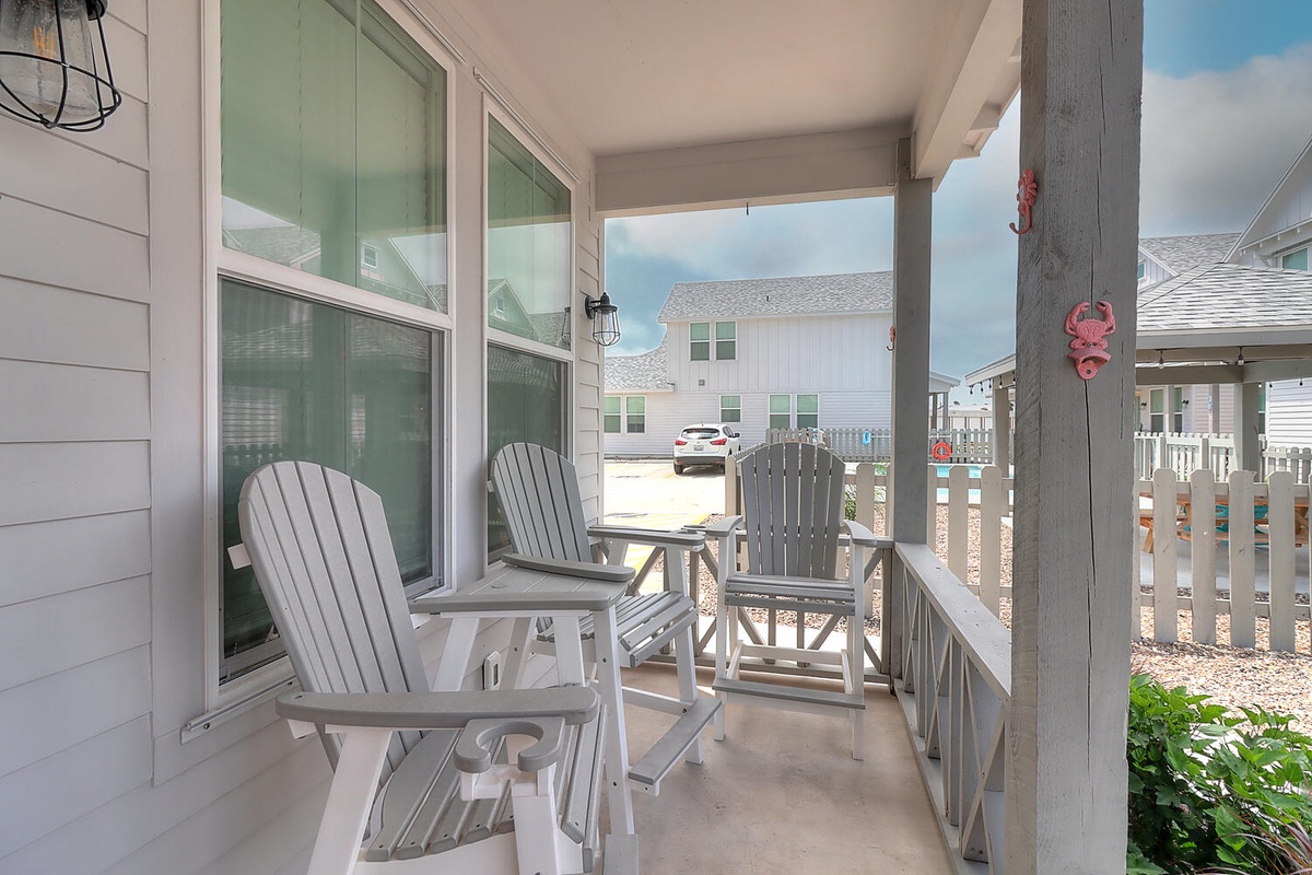 Unwind on your private porch with comfy Adirondack chairs, perfect for morning coffee or evening relaxation in the peaceful coastal setting.