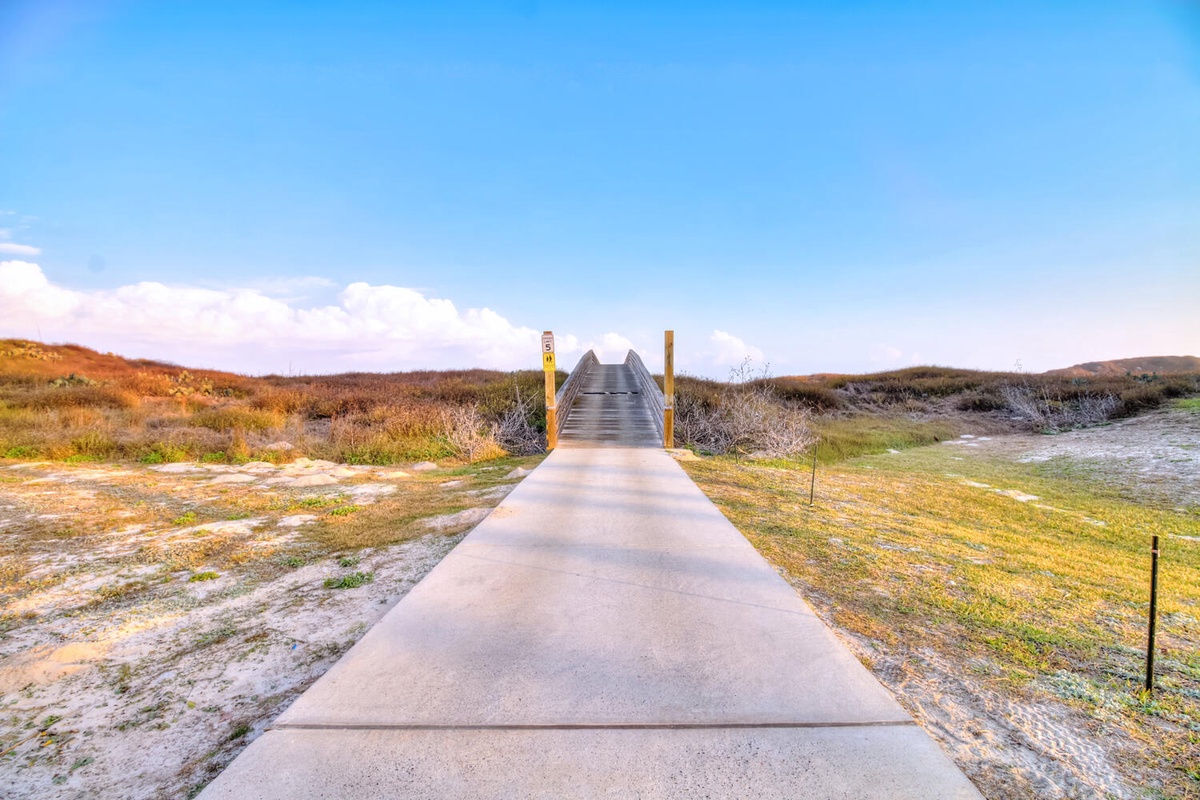 Scenic boardwalk through the coastal dunes with convenient golf cart access to the beach and the best of Port Aransas.