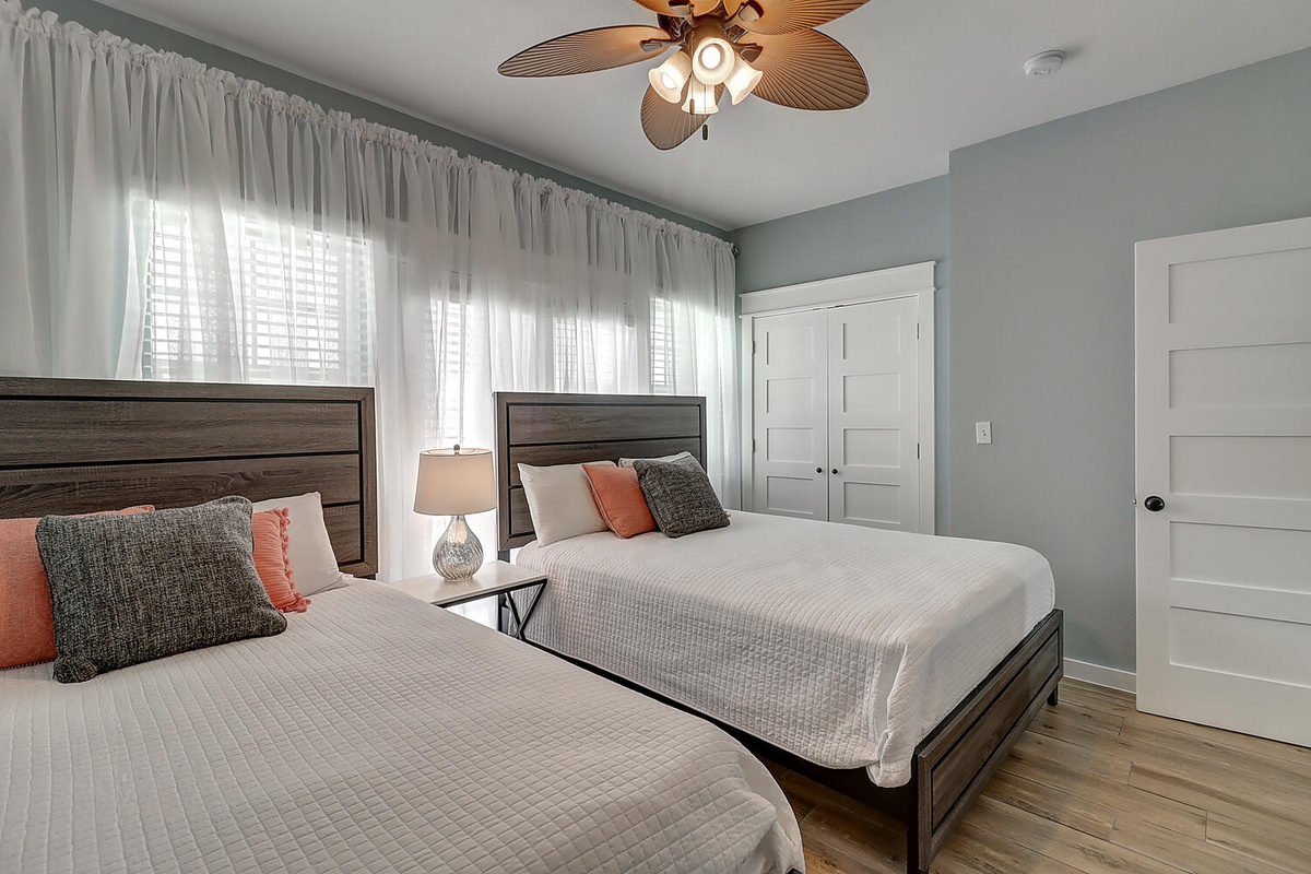 Drift off peacefully in your serene twin bedroom, where soft coastal colors and plush bedding create the perfect retreat.