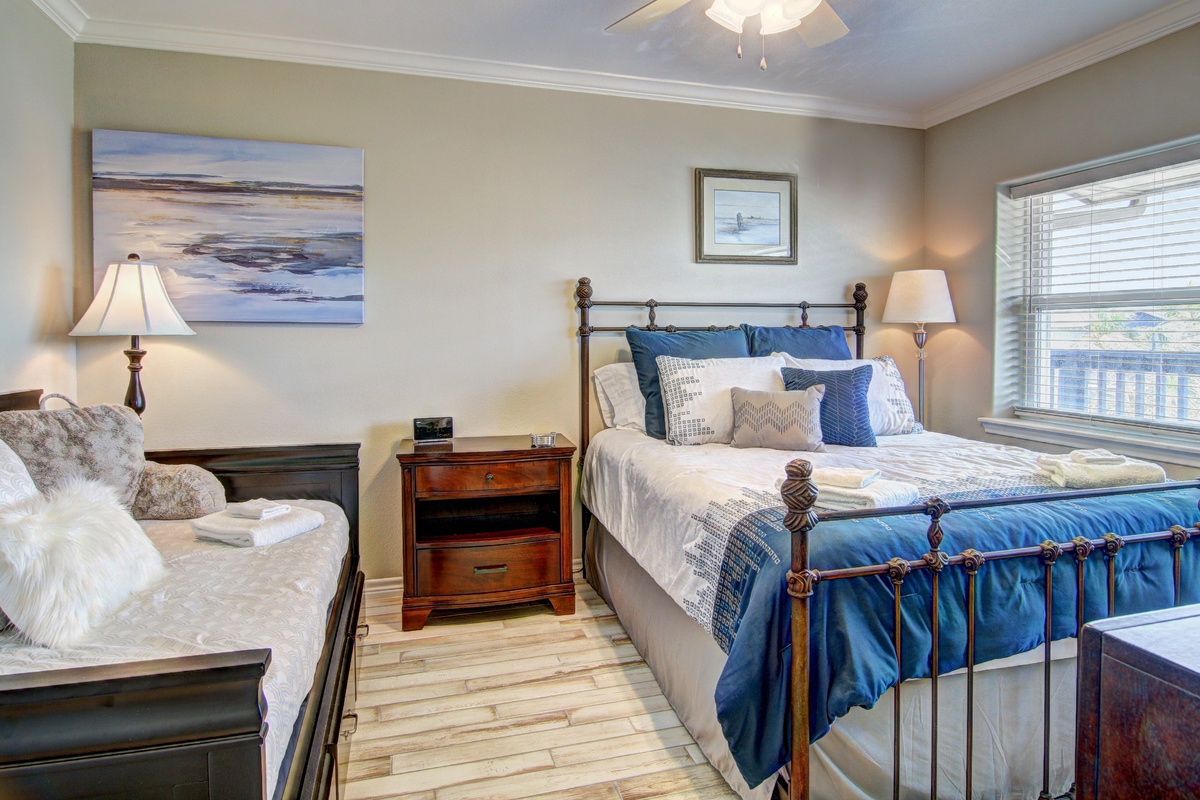 Sink into your cozy bedroom retreat with coastal artwork, plush bedding, and warm lighting creating the perfect sanctuary for restful nights.