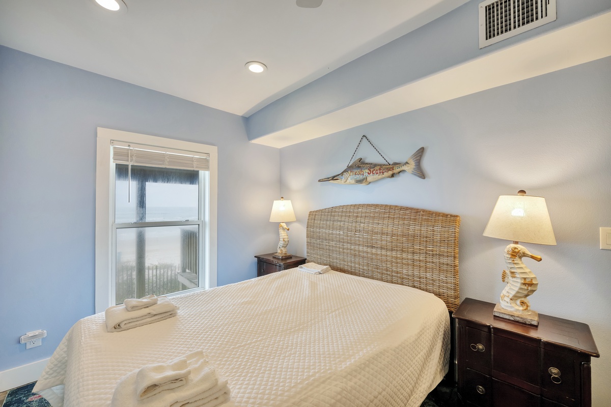 Drift off in this coastal bedroom where nautical charm meets comfort, complete with soft linens and ocean-inspired touches.