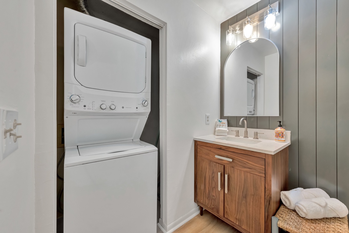 Your own in-unit laundry makes longer stays effortless, while the stylish vanity and modern lighting create a spa-like retreat.