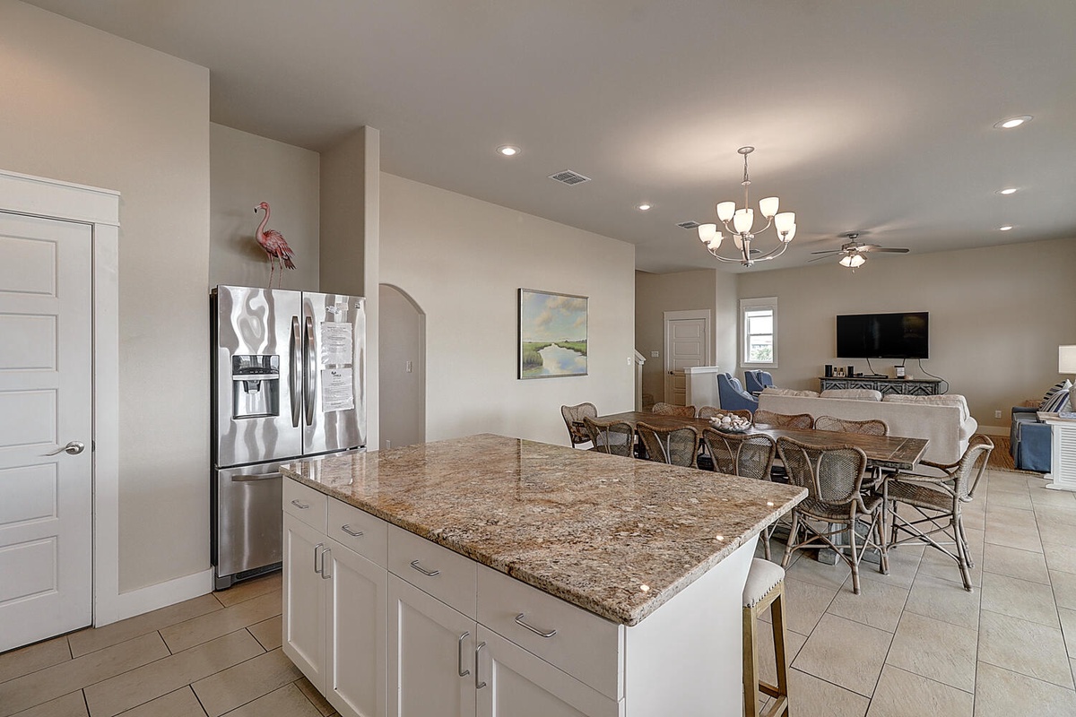 Your open kitchen flows seamlessly into the dining and living areas, perfect for gathering with friends and family.