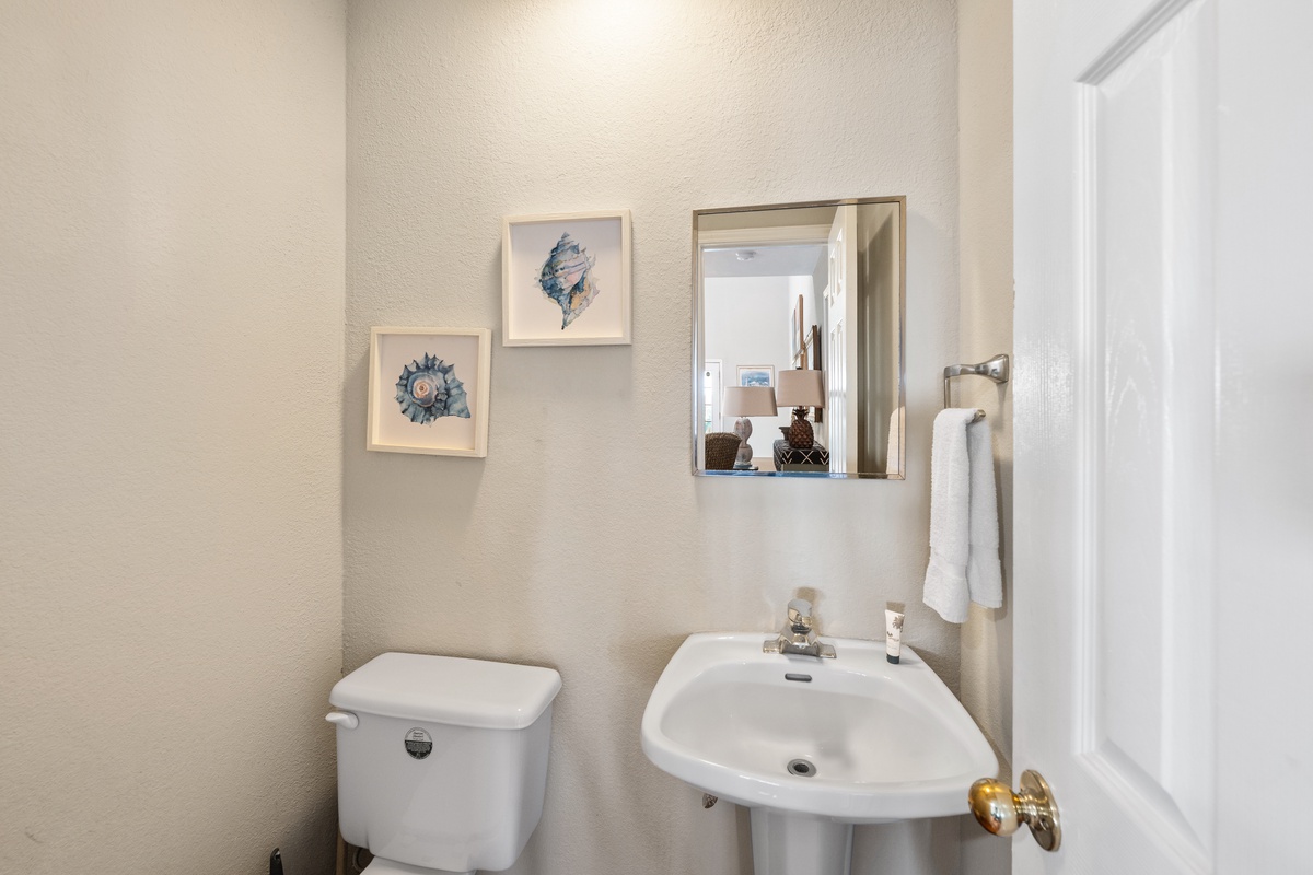 Freshen up in your clean, well-appointed bathroom with coastal charm—fluffy towels and thoughtful touches make you feel right at home.