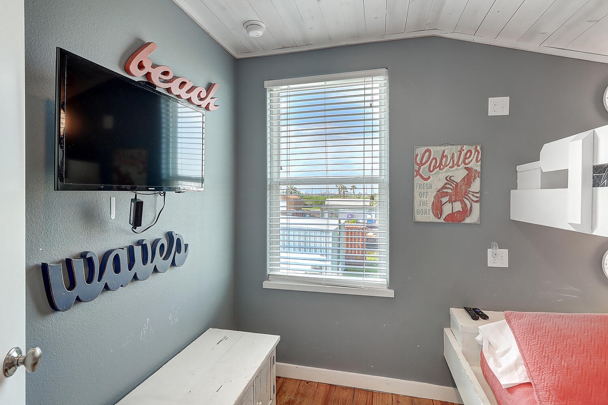 Drift off to beach dreams in this charming coastal bedroom where playful nautical touches meet modern comfort for your perfect seaside retreat.