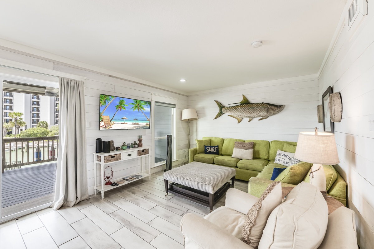 Sink into the bright coastal living space, where soft furnishings and beach-inspired décor invite you to unwind after a day of sun and surf.