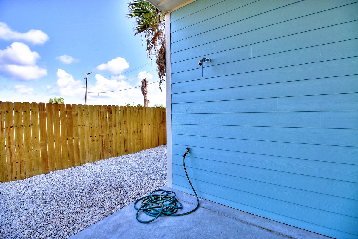 Rinse off sandy feet at this convenient outdoor shower station, complete with fresh water and tropical privacy.