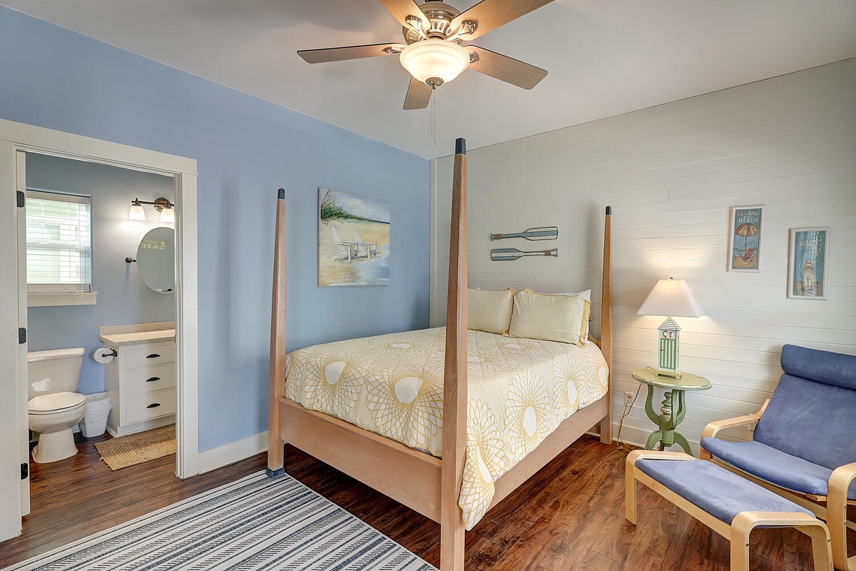 Relax in your coastal-inspired bedroom with four-poster bed and cozy seating nook, complete with private ensuite.
