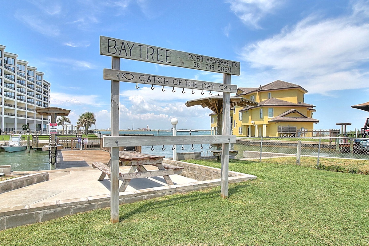 Charming waterfront area with fish cleaning station and scenic bay views, perfect for outdoor adventures.