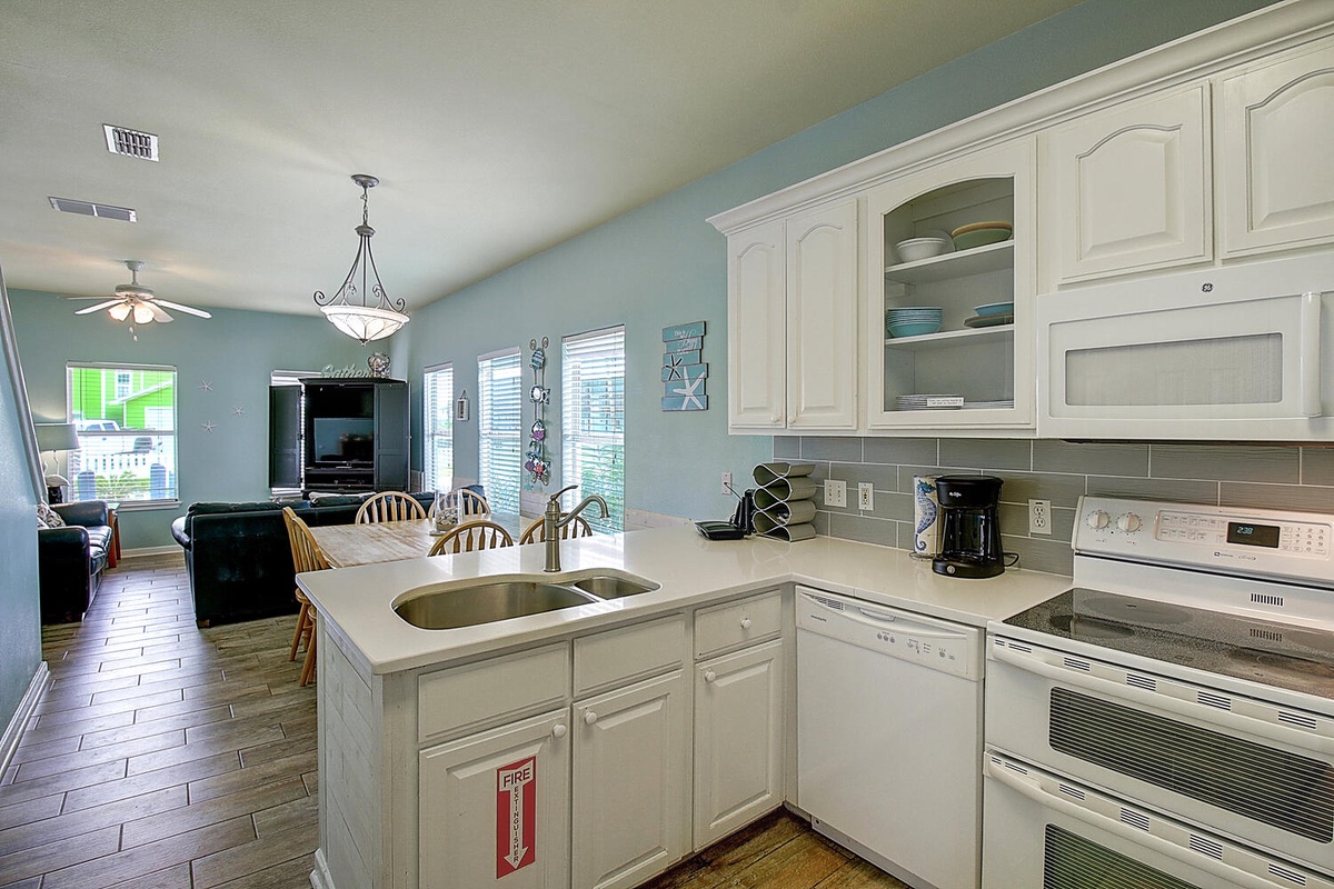Your fully equipped kitchen flows into the bright dining and living areas, perfect for cooking meals and gathering together.