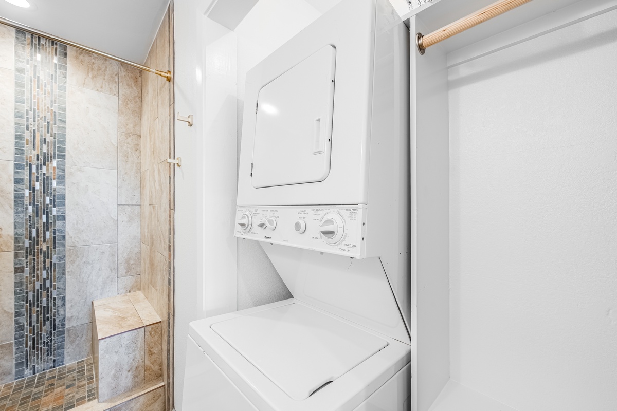 Your private laundry setup makes longer stays effortless, while the elegant tiled shower awaits your relaxing moments.