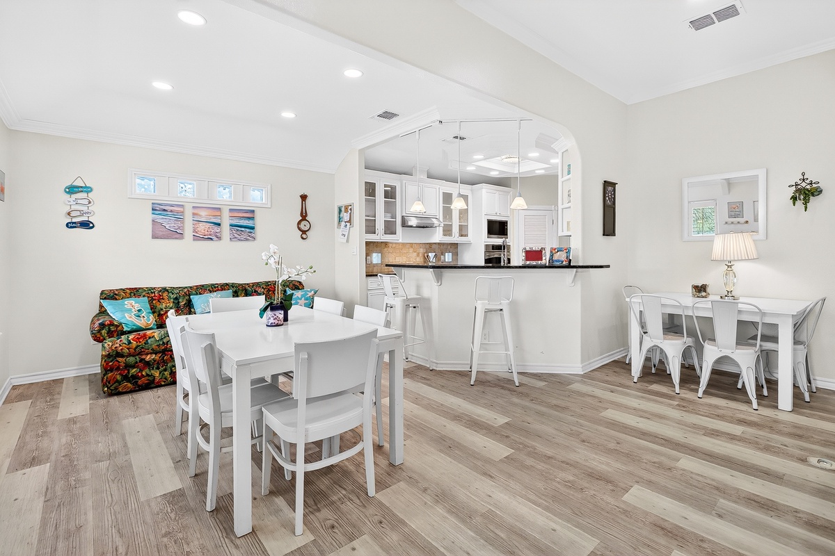 Relax in your bright, open living space where the kitchen flows seamlessly into cozy dining areas, creating the perfect gathering spot for memorable meals.