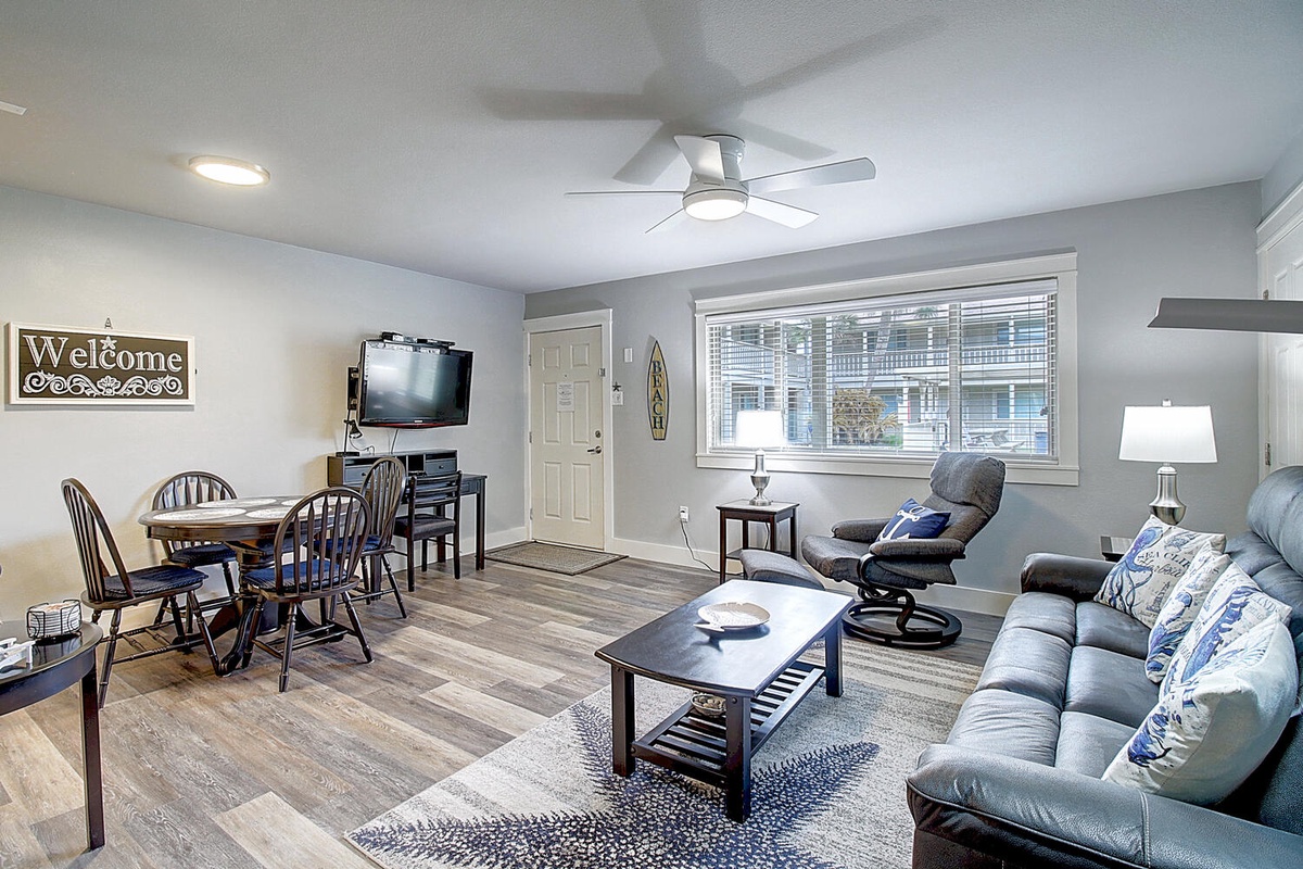 Sink into the plush sofa and enjoy your favorite shows on the mounted TV in this welcoming living space.