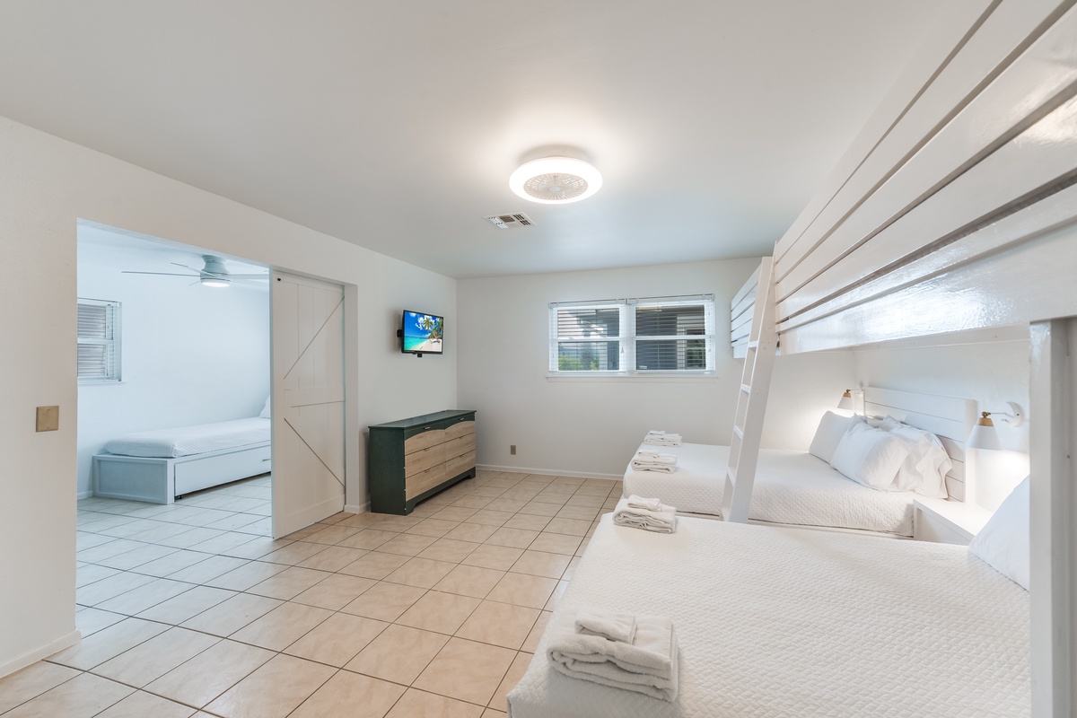 Unwind in your spacious bunk room with crisp linens and modern amenities, perfect for groups seeking comfort and convenience.