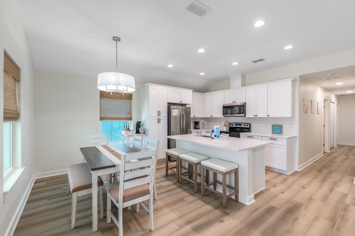 Your spacious kitchen and dining area features modern appliances, quartz countertops, and a breakfast island where you can sip morning coffee.