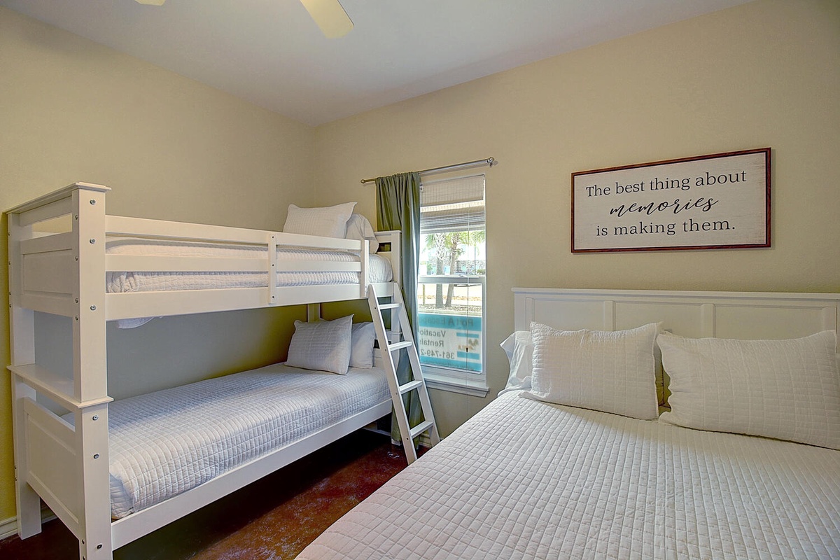 Your family bedroom features a queen bed and twin bunk bed, perfect for creating cherished vacation memories together.