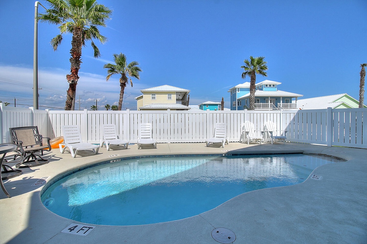 Dive into your private oasis where sparkling blue waters meet sunny skies, surrounded by swaying palms and poolside loungers perfect for soaking up the Florida sunshine.