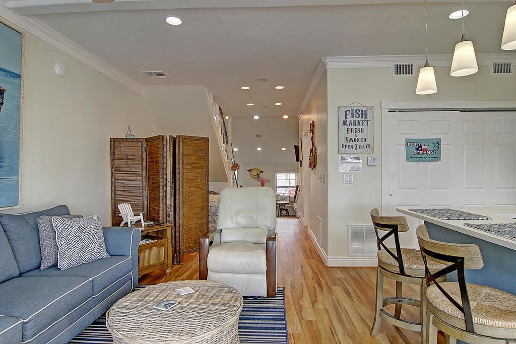 Relax in this coastal-themed space where nautical charm meets modern comfort. Your morning coffee awaits at the breakfast bar.