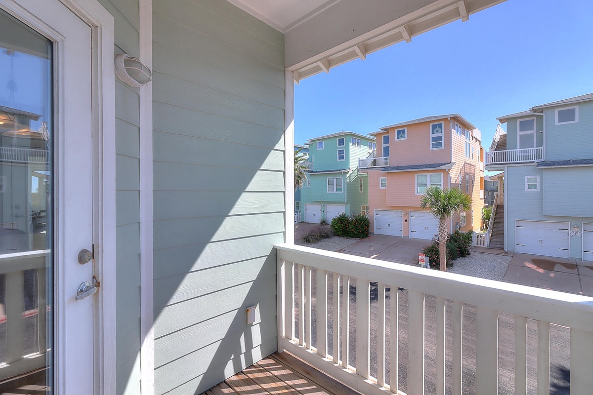 Step onto your private balcony and soak in the colorful coastal charm surrounding this beach community retreat.