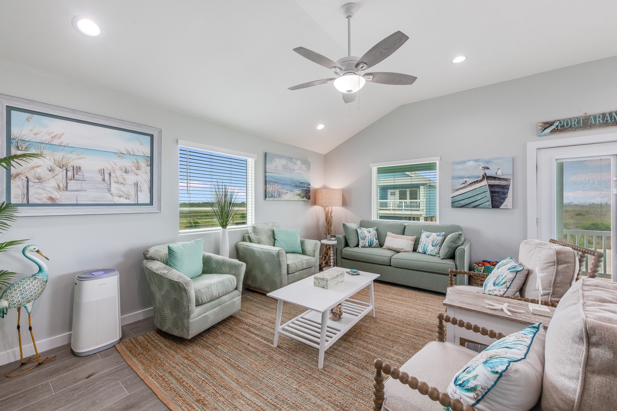 Sink into coastal tranquility in your bright living room, where sea-inspired artwork and soft furnishings create your perfect beach retreat sanctuary.