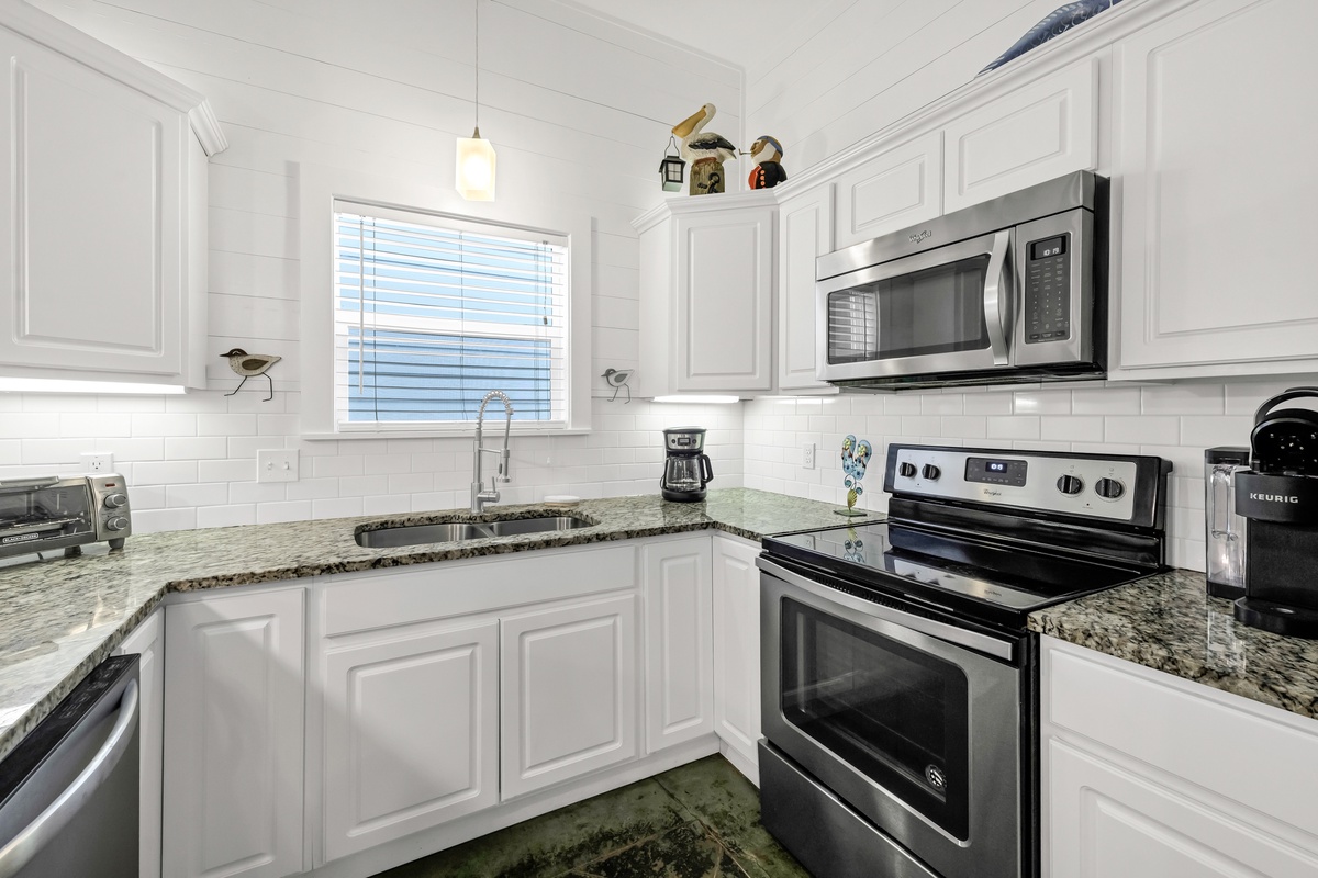 Your fully equipped kitchen features granite counters, stainless appliances, and everything you need to prepare memorable meals during your stay.