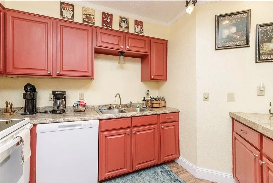 Enjoy creating culinary memories in your fully equipped kitchen with charming red cabinets, granite counters, and thoughtful coffee-themed touches.