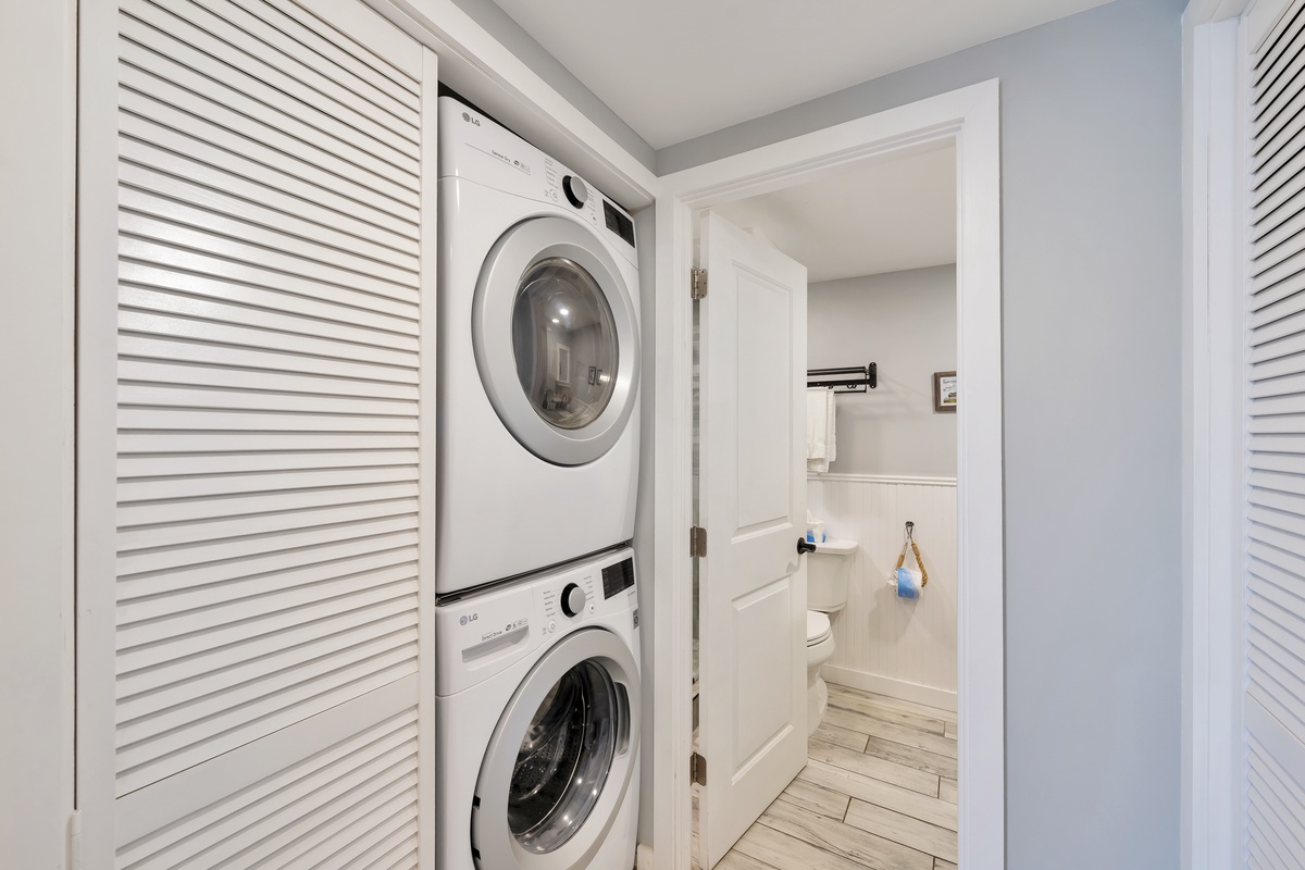 Your private laundry closet makes extended stays effortless with stacked washer and dryer tucked behind elegant louvered doors.