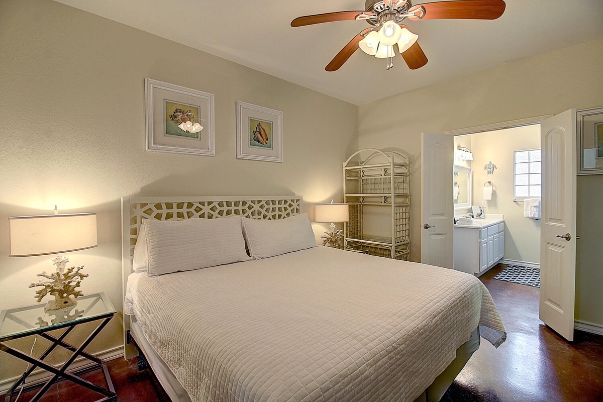 Drift into peaceful sleep in your elegantly appointed bedroom, where soft lighting and coastal charm create the perfect retreat after your adventures.