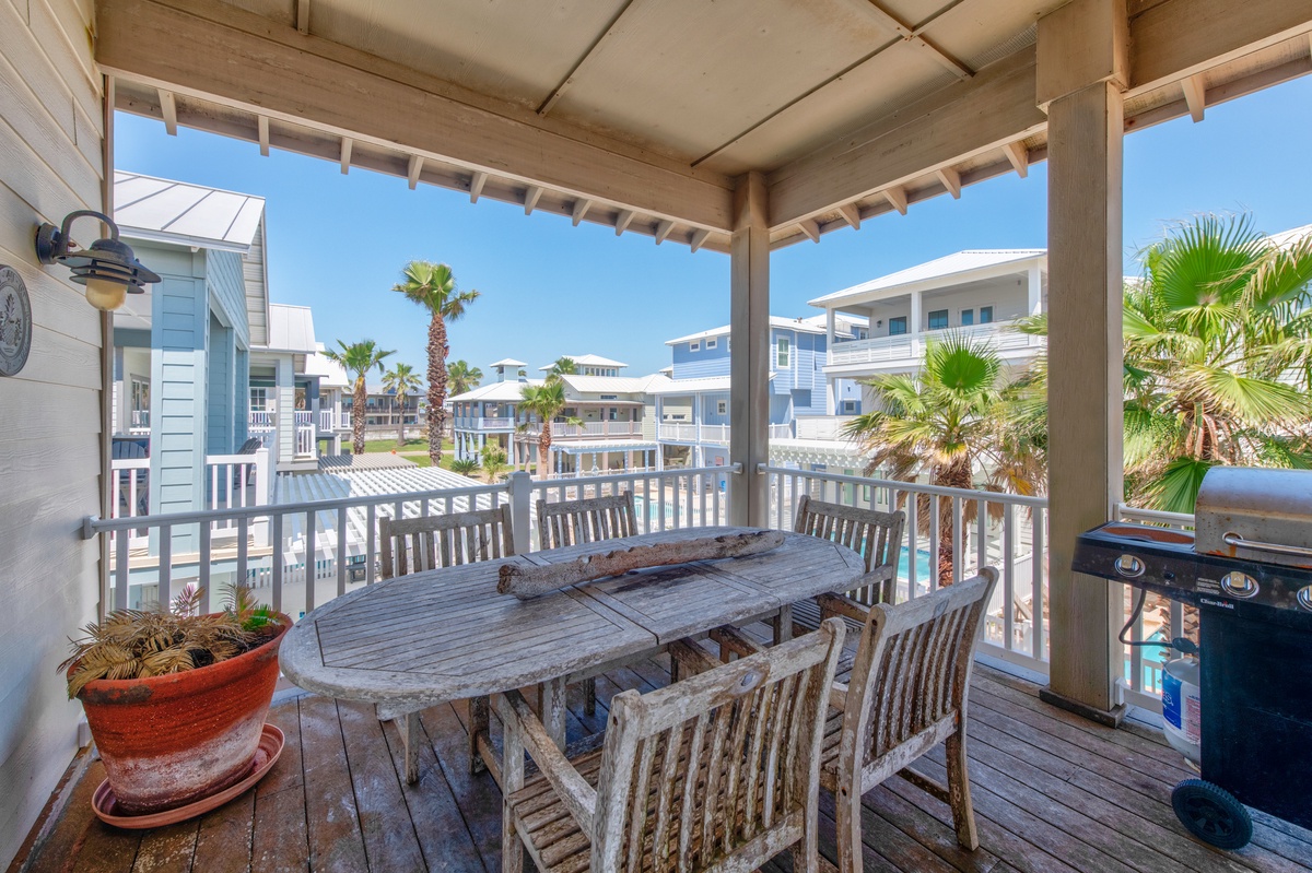 Dine al fresco on your private covered balcony with coastal views and BBQ grill ready for memorable meals.