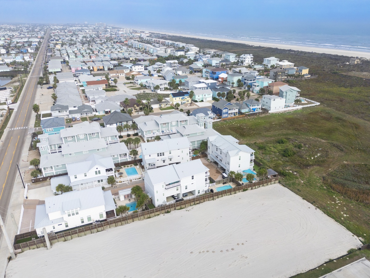 Coastal community with pristine beachfront homes and private pools, minutes from endless sandy shores and Atlantic waters.