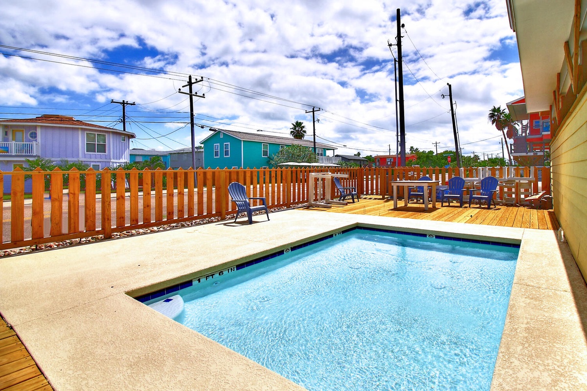 Your private pool awaits with comfortable lounge chairs and spacious deck for relaxing under the sunny sky.
