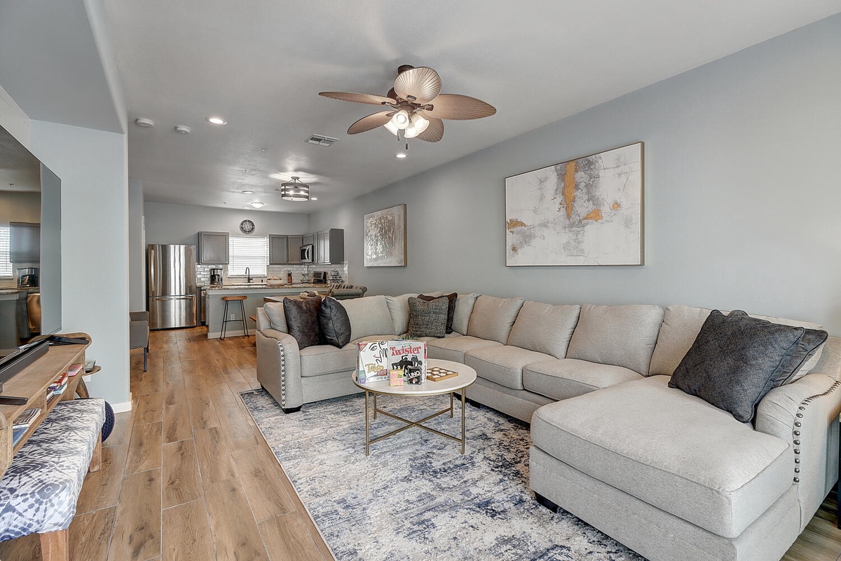Unwind in your spacious living room with plush sectional seating and modern kitchen—perfect for relaxing after exploring.