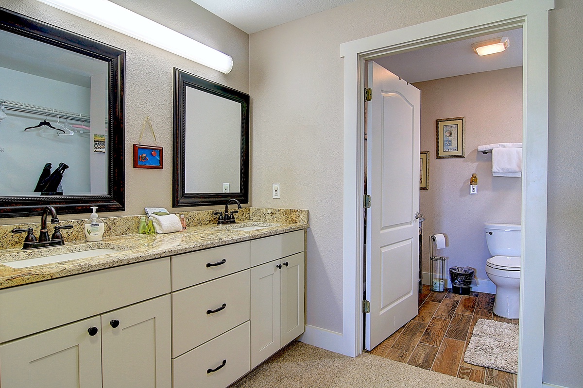 Step into your spacious ensuite with dual vanities and granite countertops, plus a private water closet for added convenience.