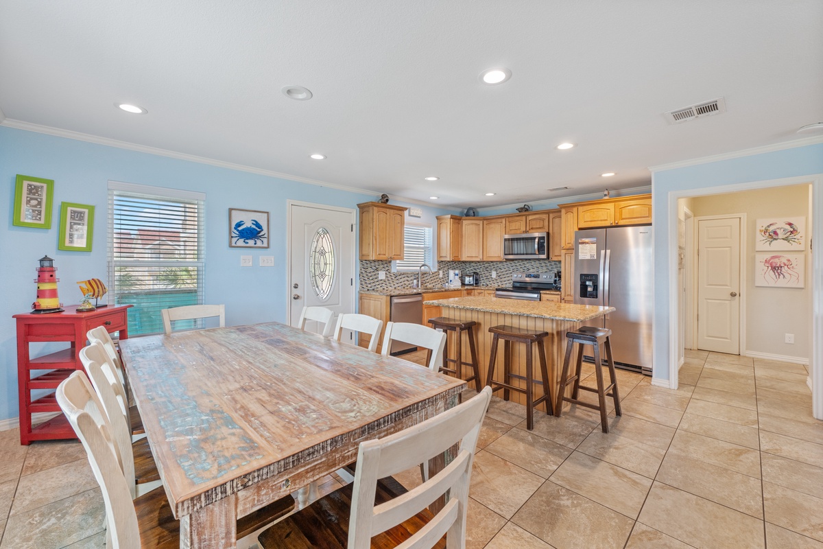 Your spacious kitchen flows into a bright dining area where you'll share memorable meals with ocean-inspired decor surrounding you.