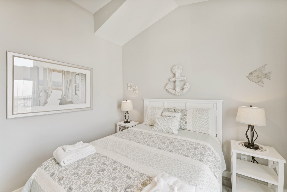 Drift into peaceful sleep in your coastal-themed bedroom, where soft whites and gentle nautical touches create the perfect seaside sanctuary.