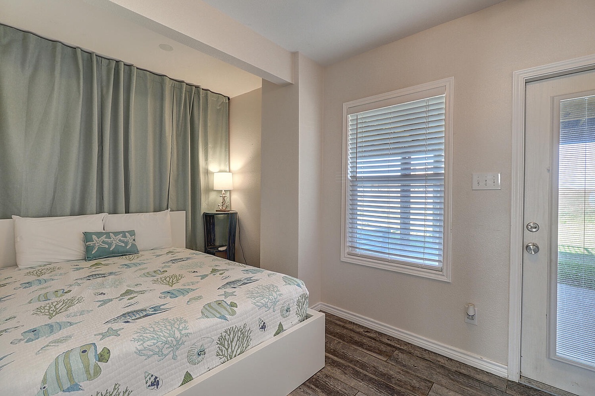 Drift off in your serene bedroom with ocean-themed linens and soft lighting for peaceful nights.