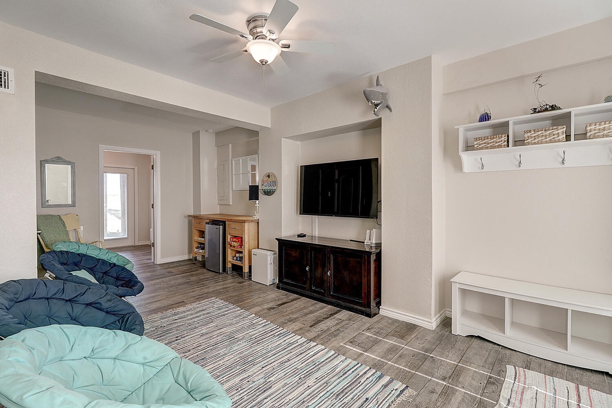 Unwind in your cozy living space with plush seating, entertainment center, and thoughtful storage solutions for all your belongings.