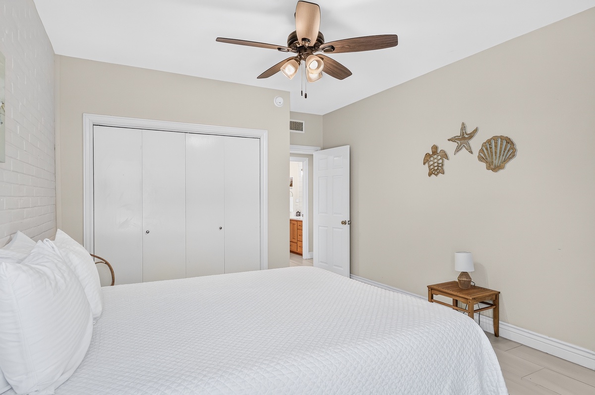 Relax into your peaceful coastal retreat featuring soft linens and charming beach-inspired decor that brings the ocean breeze inside.