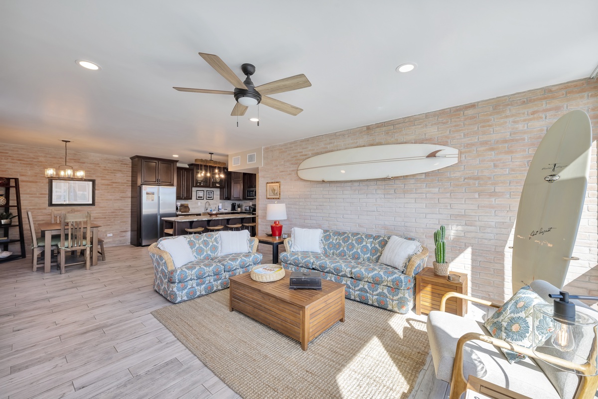 Your coastal-inspired living space features comfortable seating and an open kitchen, perfect for relaxing after beach days.