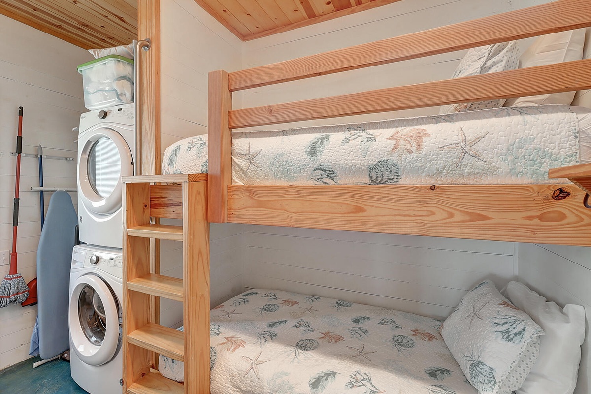 Your cozy bunk bed setup maximizes space while offering comfort, with convenient laundry facilities right next door for extended stays.