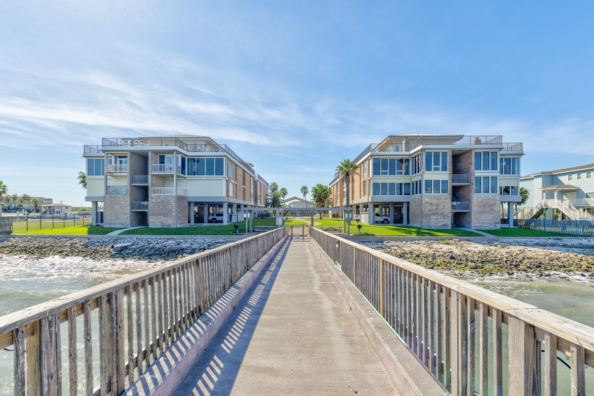Modern waterfront condominiums positioned directly on the coastline with private pier access for arriving guests.