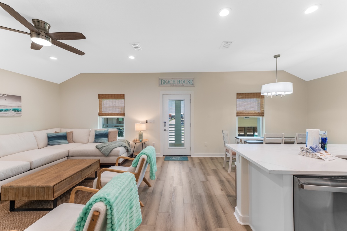 Relax in this bright, beachy living space where coastal charm meets modern comfort with soft seating and ocean-inspired accents.