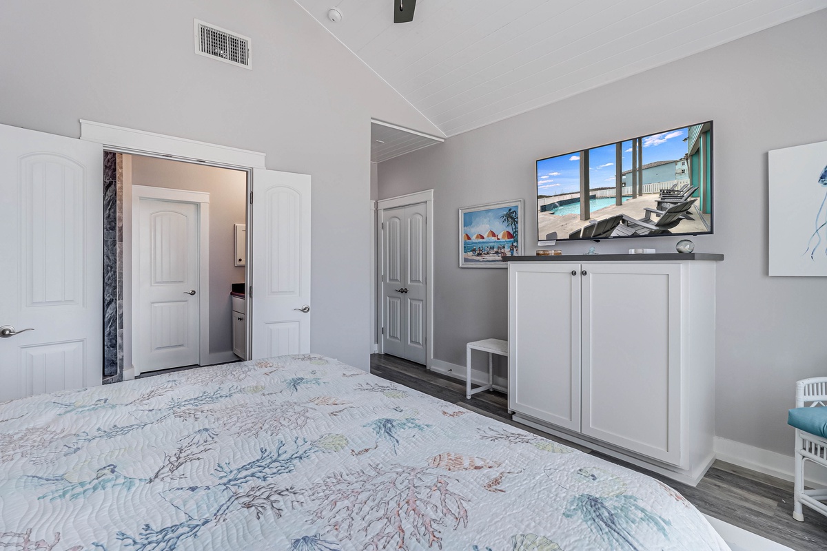 Relax in your bright bedroom with coastal décor, built-in storage, and TV for peaceful evenings after exploring.