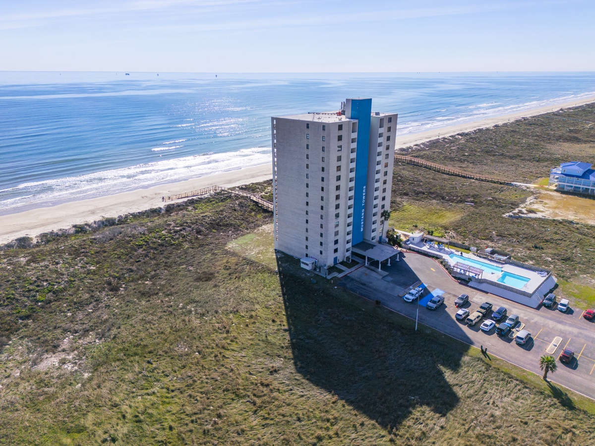 Beachfront high-rise property offering stunning ocean access and coastal views in a pristine natural setting.