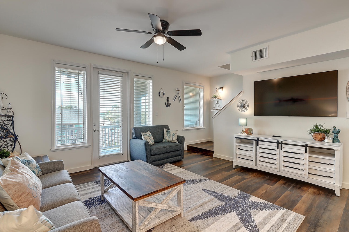 Sink into plush seating while enjoying coastal charm with nautical accents and large windows flooding your space with natural light.