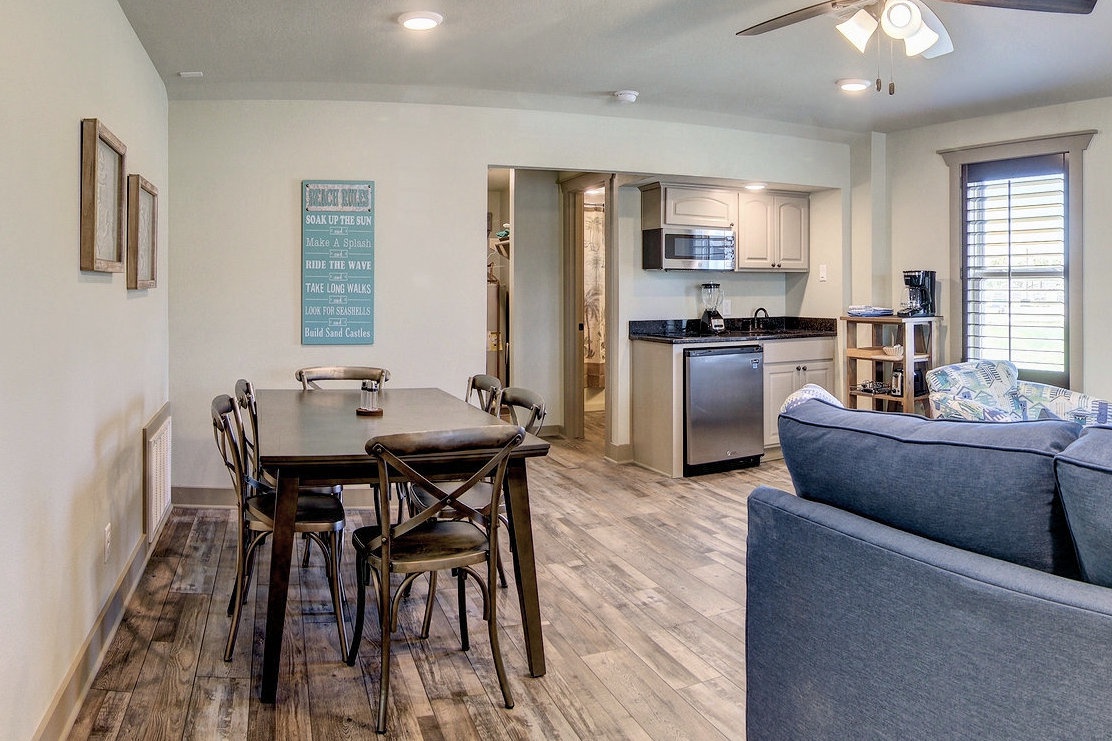 Relax in your open-concept space where the living room flows seamlessly into the dining area and fully equipped kitchen, perfect for memorable meals together.
