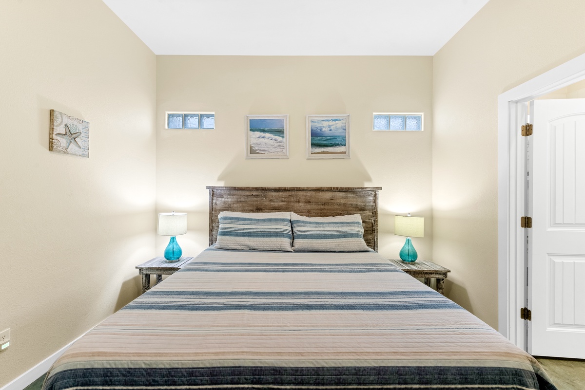 Drift into coastal dreams in your serene bedroom with ocean-inspired artwork and soothing blue accents.