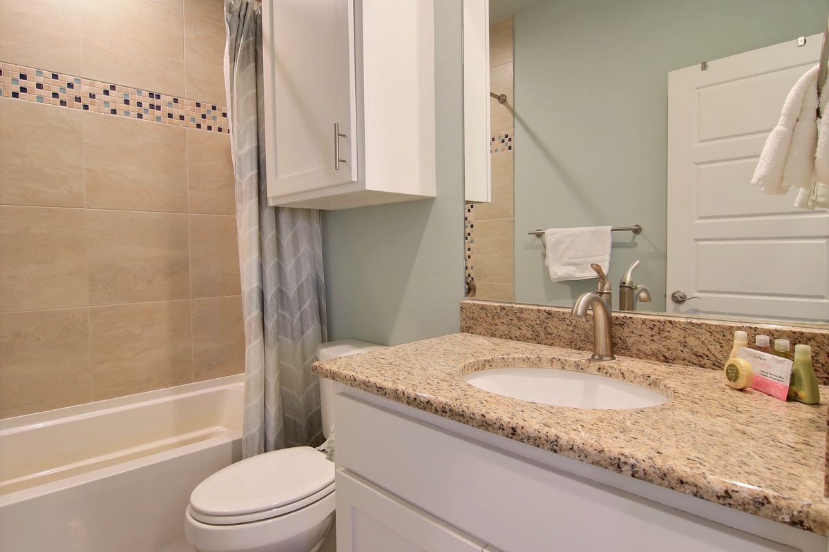 Refresh yourself in your beautifully appointed bathroom with granite countertops, modern fixtures, and a relaxing tub.