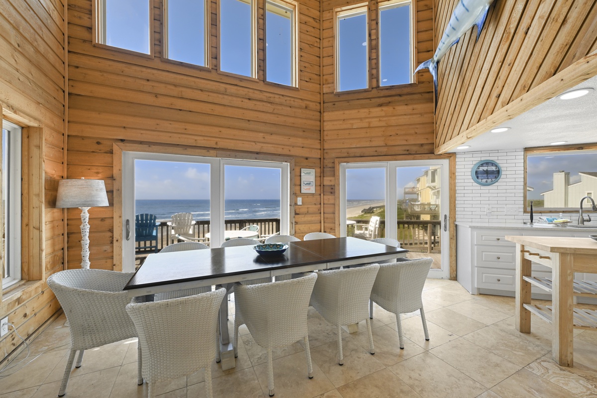 Picture yourself dining here, surrounded by soaring wood-paneled walls and sunlight streaming through expansive windows. Your oceanfront table offers breathtaking coastal views, making every meal feel like a celebration of the sea.